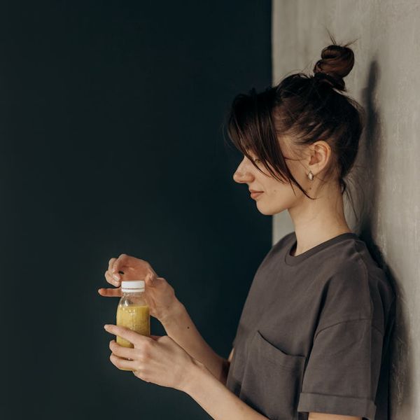 Person smiling peacefully after a light exercise session, looking refreshed.